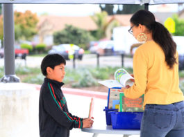 Greenfield teacher hands out books to area youth